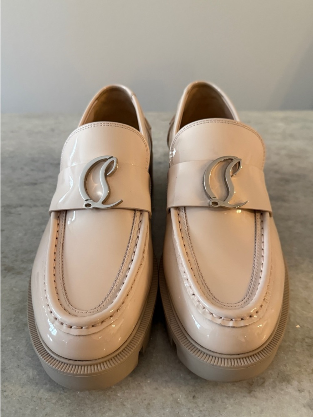 Christian Louboutin CL Moc Lug patent leather loafers.